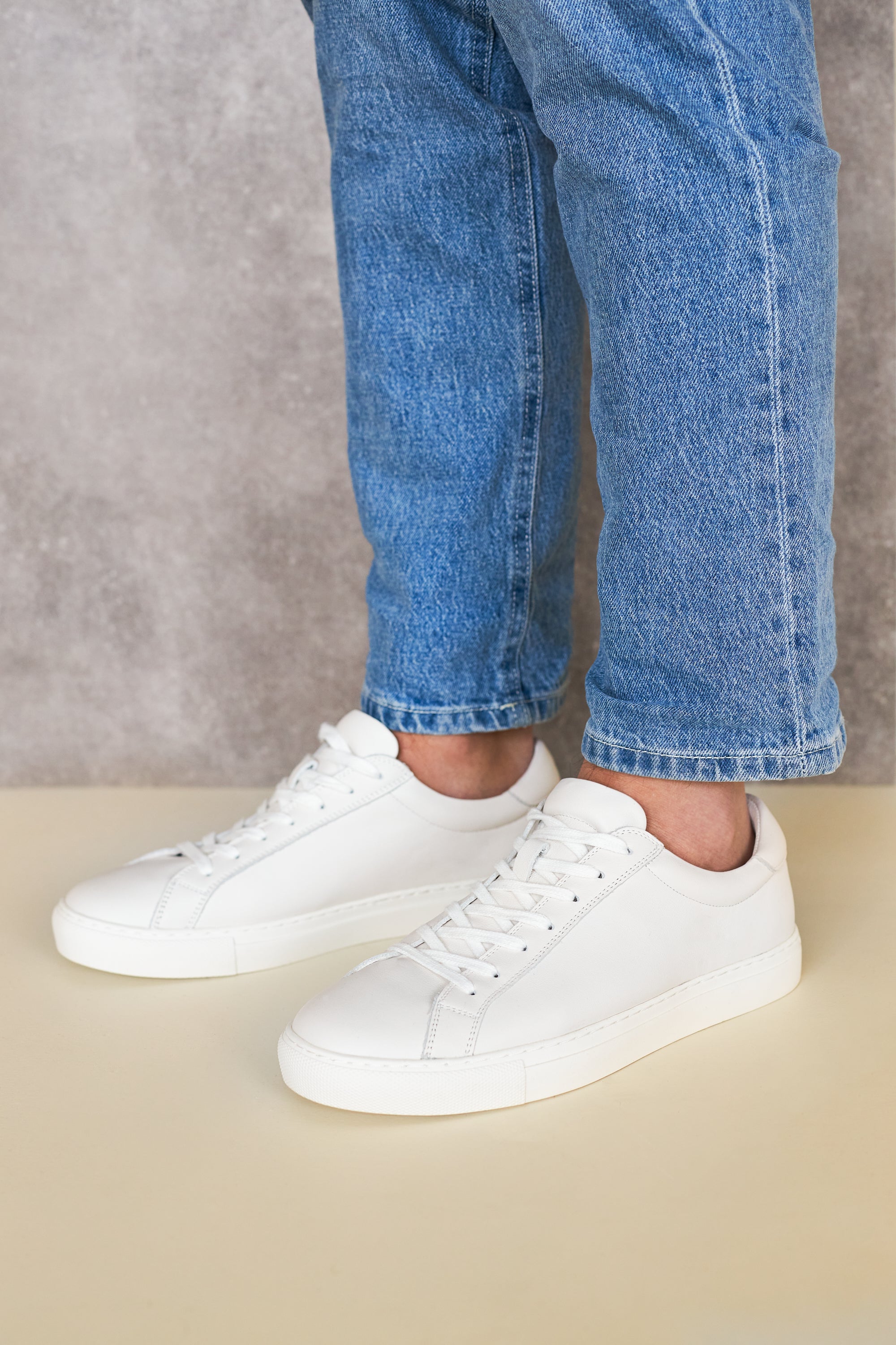 White leather Neat sneakers styled with blue jeans